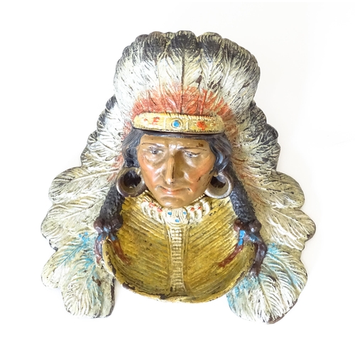 1199 - A late 20thC cast novelty inkwell formed as a Native American Indian with headdress. Approx. 4 1/4