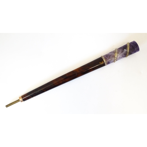 1202 - An early 20thC tortoiseshell parasol handle with blue john and rock crystal detail, with indistinctl... 