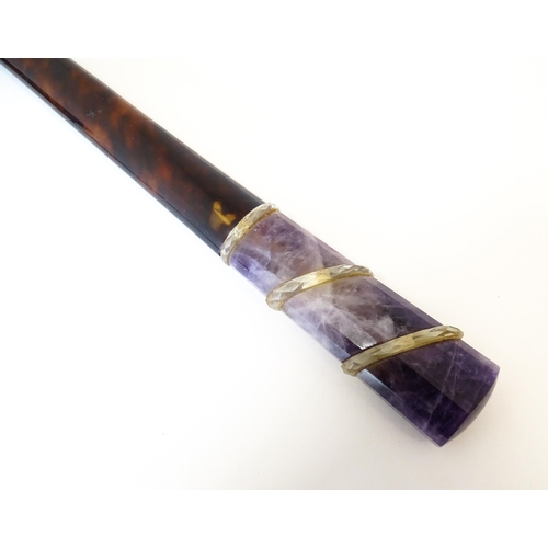 1202 - An early 20thC tortoiseshell parasol handle with blue john and rock crystal detail, with indistinctl... 