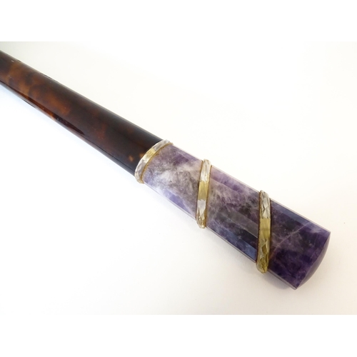 1202 - An early 20thC tortoiseshell parasol handle with blue john and rock crystal detail, with indistinctl... 