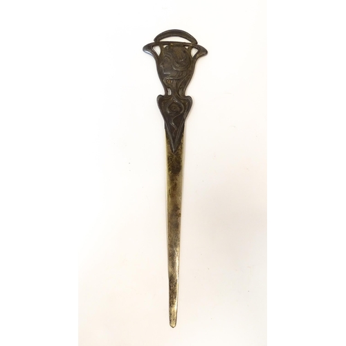 1203 - An Art Nouveau cast letter opener / paper knife with female head and tendril detail. In the WMF styl... 