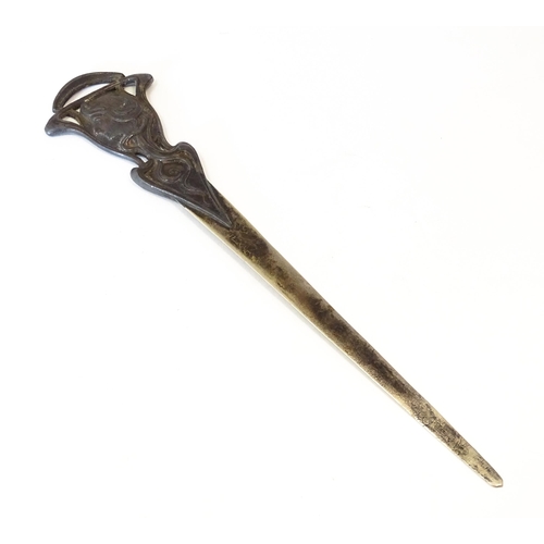 1203 - An Art Nouveau cast letter opener / paper knife with female head and tendril detail. In the WMF styl... 