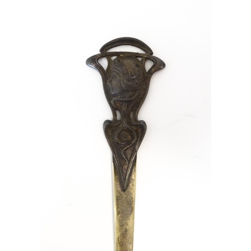 1203 - An Art Nouveau cast letter opener / paper knife with female head and tendril detail. In the WMF styl... 