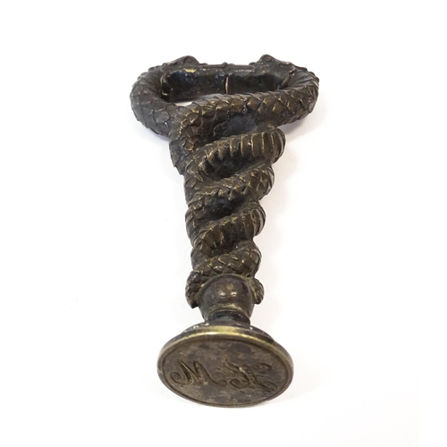 1204 - A 19thC cast desk / hand seal formed as two intertwined dragons / sea serpents, with monogram to sea... 