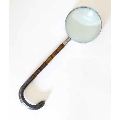 1208 - A silver mounted parasol handle with magnifying glass to one end. Approx. 13