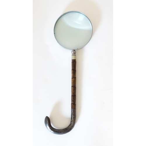 1208 - A silver mounted parasol handle with magnifying glass to one end. Approx. 13