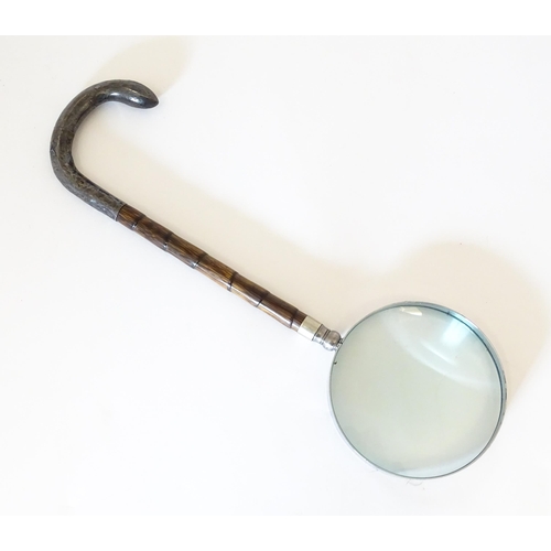 1208 - A silver mounted parasol handle with magnifying glass to one end. Approx. 13