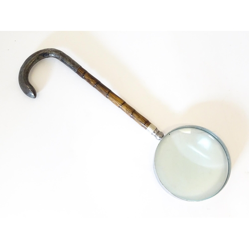 1208 - A silver mounted parasol handle with magnifying glass to one end. Approx. 13