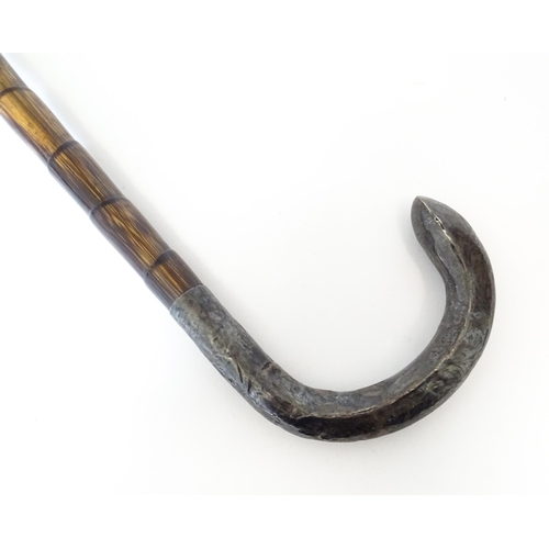 1208 - A silver mounted parasol handle with magnifying glass to one end. Approx. 13