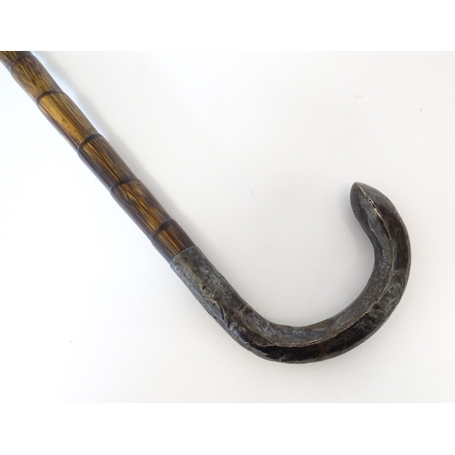 1208 - A silver mounted parasol handle with magnifying glass to one end. Approx. 13