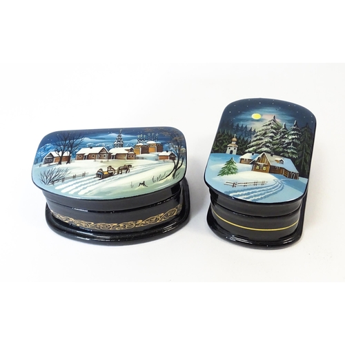 1212 - Two late 20thC Russian lacquered boxes decorated with winter scenes. Signed in Cyrillic under. Large... 