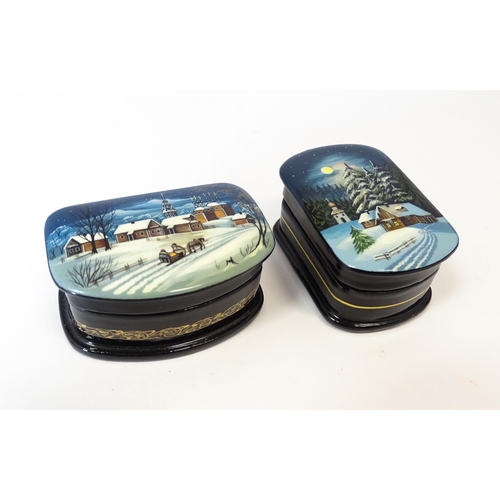 1212 - Two late 20thC Russian lacquered boxes decorated with winter scenes. Signed in Cyrillic under. Large... 