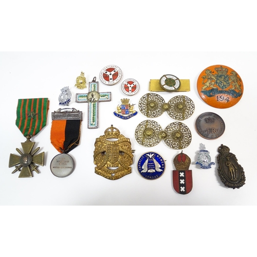 1214 - A quantity of assorted medals, badges and pins, to include a hand painted wooden badge decorated wit... 