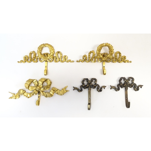 1217 - A quantity of assorted 20thC hangers / hooks with bow and chaplet detail, to include three gilt meta... 