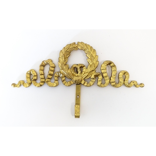 1217 - A quantity of assorted 20thC hangers / hooks with bow and chaplet detail, to include three gilt meta... 