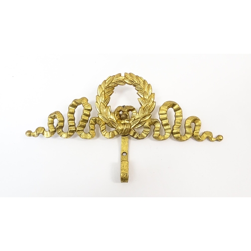 1217 - A quantity of assorted 20thC hangers / hooks with bow and chaplet detail, to include three gilt meta... 