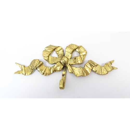 1217 - A quantity of assorted 20thC hangers / hooks with bow and chaplet detail, to include three gilt meta... 