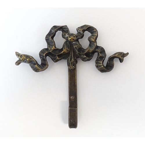 1217 - A quantity of assorted 20thC hangers / hooks with bow and chaplet detail, to include three gilt meta... 