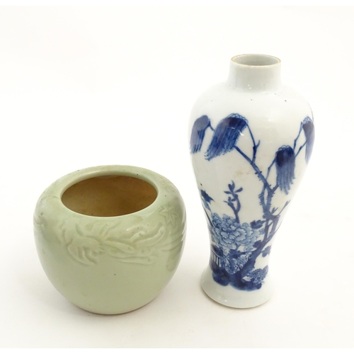 201 - A Chinese blue and white vase decorated with a garden scene with flowers and trees. Together with a ... 