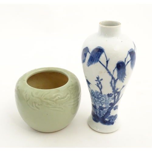 201 - A Chinese blue and white vase decorated with a garden scene with flowers and trees. Together with a ... 