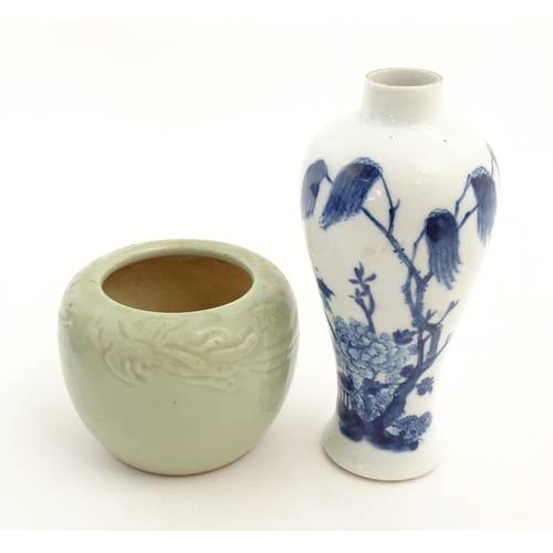 201 - A Chinese blue and white vase decorated with a garden scene with flowers and trees. Together with a ... 