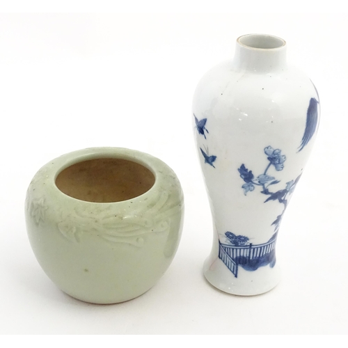 201 - A Chinese blue and white vase decorated with a garden scene with flowers and trees. Together with a ... 