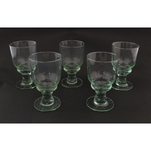 232 - A set of five pedestal drinking glasses. Approx. 5 1/2