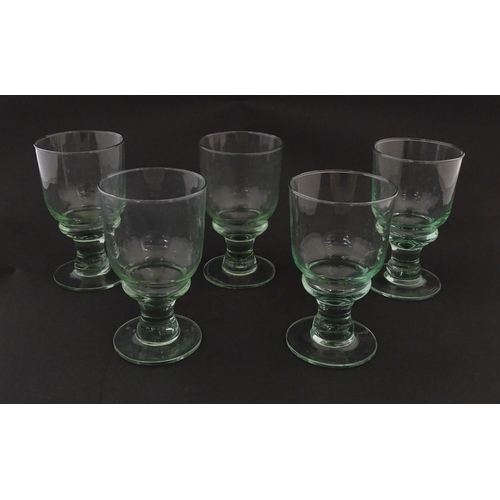 232 - A set of five pedestal drinking glasses. Approx. 5 1/2