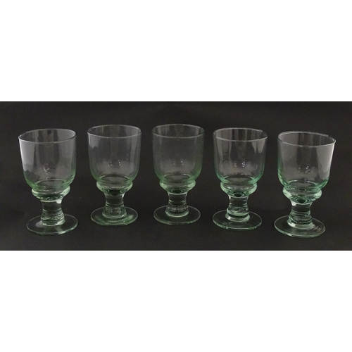 232 - A set of five pedestal drinking glasses. Approx. 5 1/2