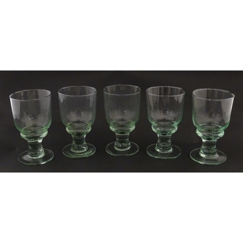 232 - A set of five pedestal drinking glasses. Approx. 5 1/2