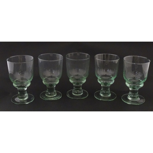 232 - A set of five pedestal drinking glasses. Approx. 5 1/2