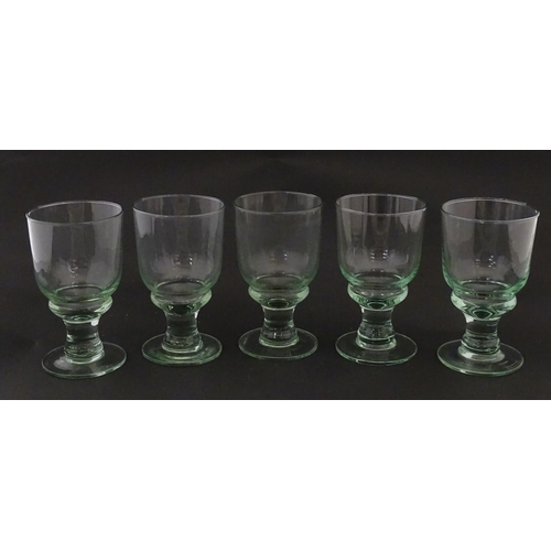 232 - A set of five pedestal drinking glasses. Approx. 5 1/2