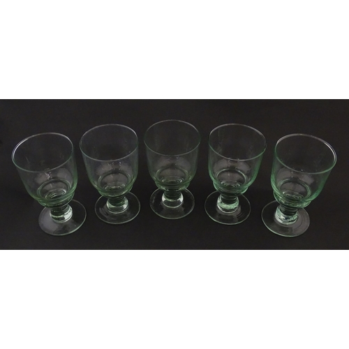 232 - A set of five pedestal drinking glasses. Approx. 5 1/2