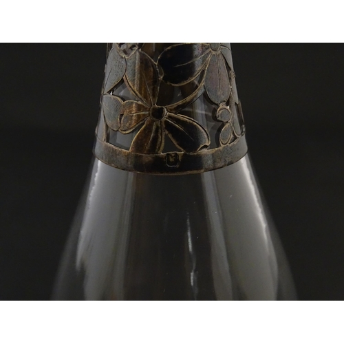 233 - A glass bottle with French silver mounts, together with a glass George III mustard pot with silver m... 