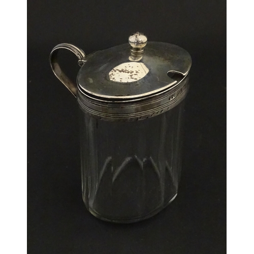 233 - A glass bottle with French silver mounts, together with a glass George III mustard pot with silver m... 