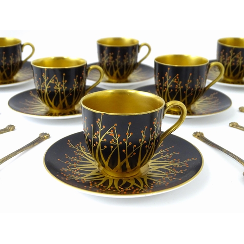 199 - A cased set of six Royal Worcester coffee cups and saucers with silver gilt spoons hallmarked London... 