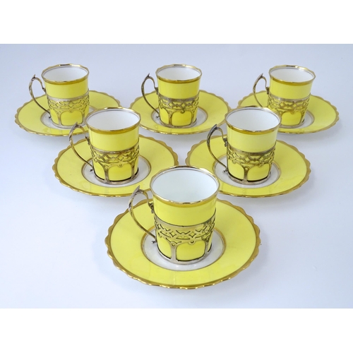 200 - A cased set of six Aynsley coffee cups and saucers, the cups with silver holders hallmarked Sheffiel... 