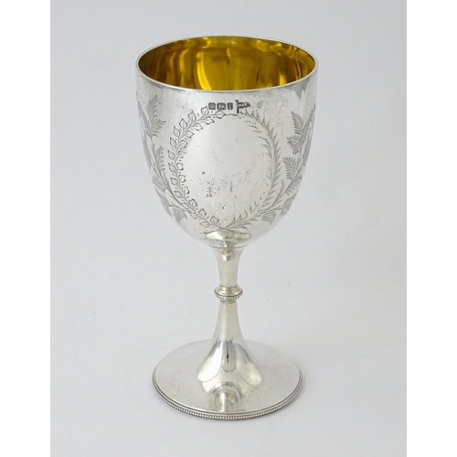 390 - A Victorian silver goblet with engraved foliate detail and gilded interior, hallmarked Sheffield 189... 