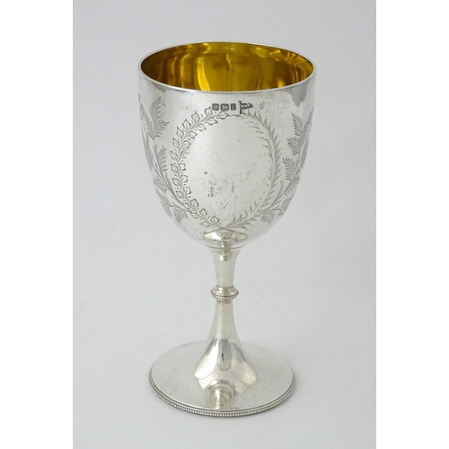 390 - A Victorian silver goblet with engraved foliate detail and gilded interior, hallmarked Sheffield 189... 