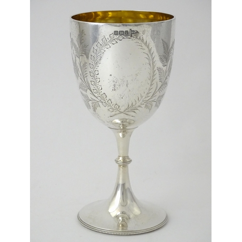 390 - A Victorian silver goblet with engraved foliate detail and gilded interior, hallmarked Sheffield 189... 