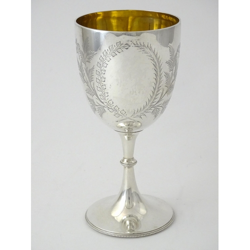 390 - A Victorian silver goblet with engraved foliate detail and gilded interior, hallmarked Sheffield 189... 