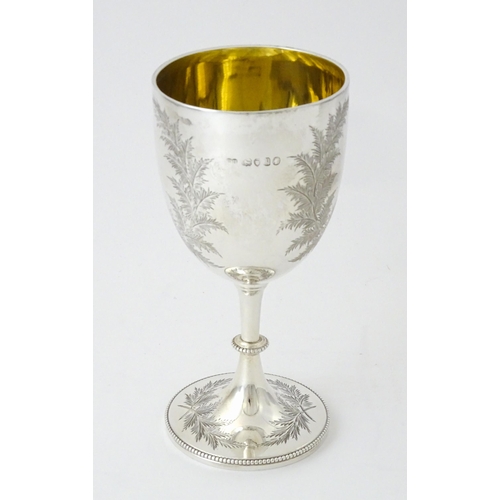 419 - A Victorian silver goblet with engraved fern detail and gilded interior, hallmarked London 1870, mak... 