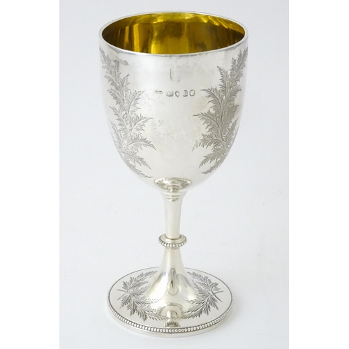 419 - A Victorian silver goblet with engraved fern detail and gilded interior, hallmarked London 1870, mak... 