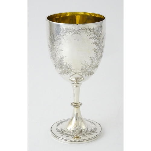 419 - A Victorian silver goblet with engraved fern detail and gilded interior, hallmarked London 1870, mak... 