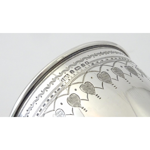 507 - A Victorian silver goblet with engraved decoration and gilded interior, hallmarked Sheffield 1876, m... 