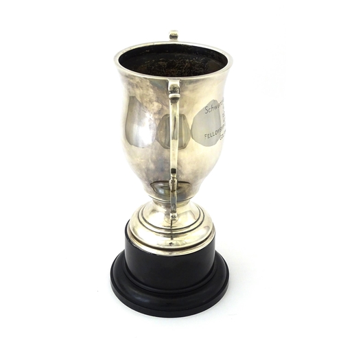 509 - A silver twin handled trophy cup bearing inscription for ' Schwarzkopf Golf Trophy Presented to P. D... 