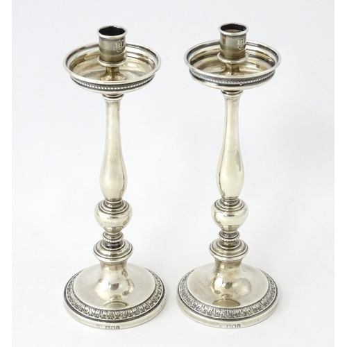 513 - A pair of silver taperstick holders hallmarked London 1910, maker Blunt & Ray. Approx. 6 3/4