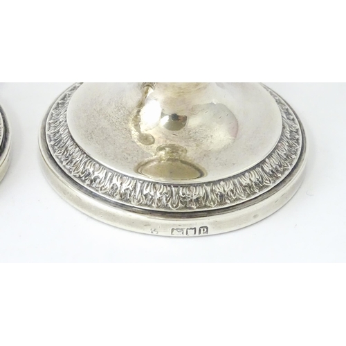 513 - A pair of silver taperstick holders hallmarked London 1910, maker Blunt & Ray. Approx. 6 3/4