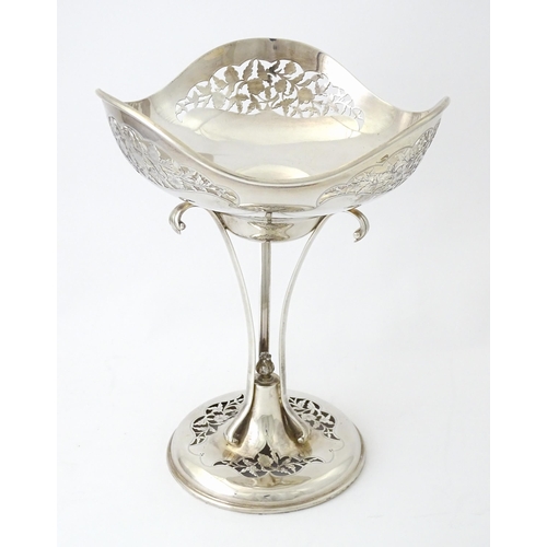 518 - A silver table centrepiece bowl of pedestal form with pierced floral and foliate decoration hallmark... 