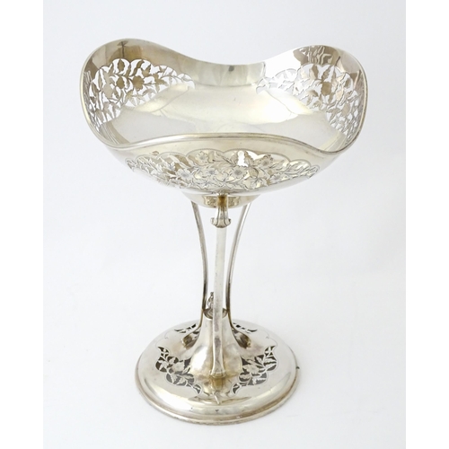 518 - A silver table centrepiece bowl of pedestal form with pierced floral and foliate decoration hallmark... 